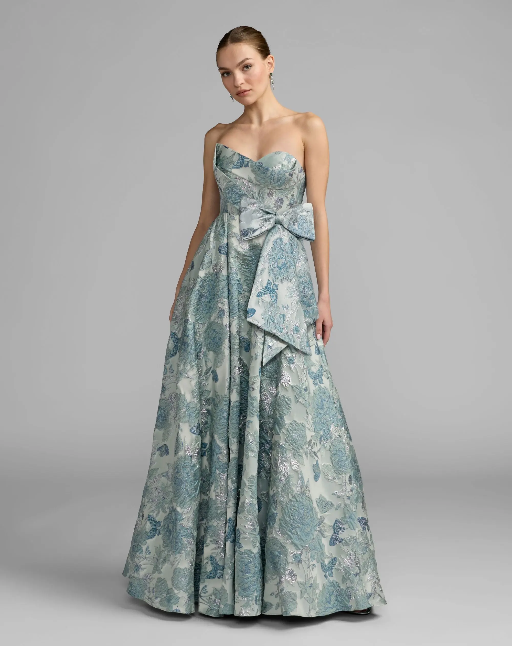 Blue Strapless Floral Brocade Ball Gown With Bow Detail - Special Events Unlimited