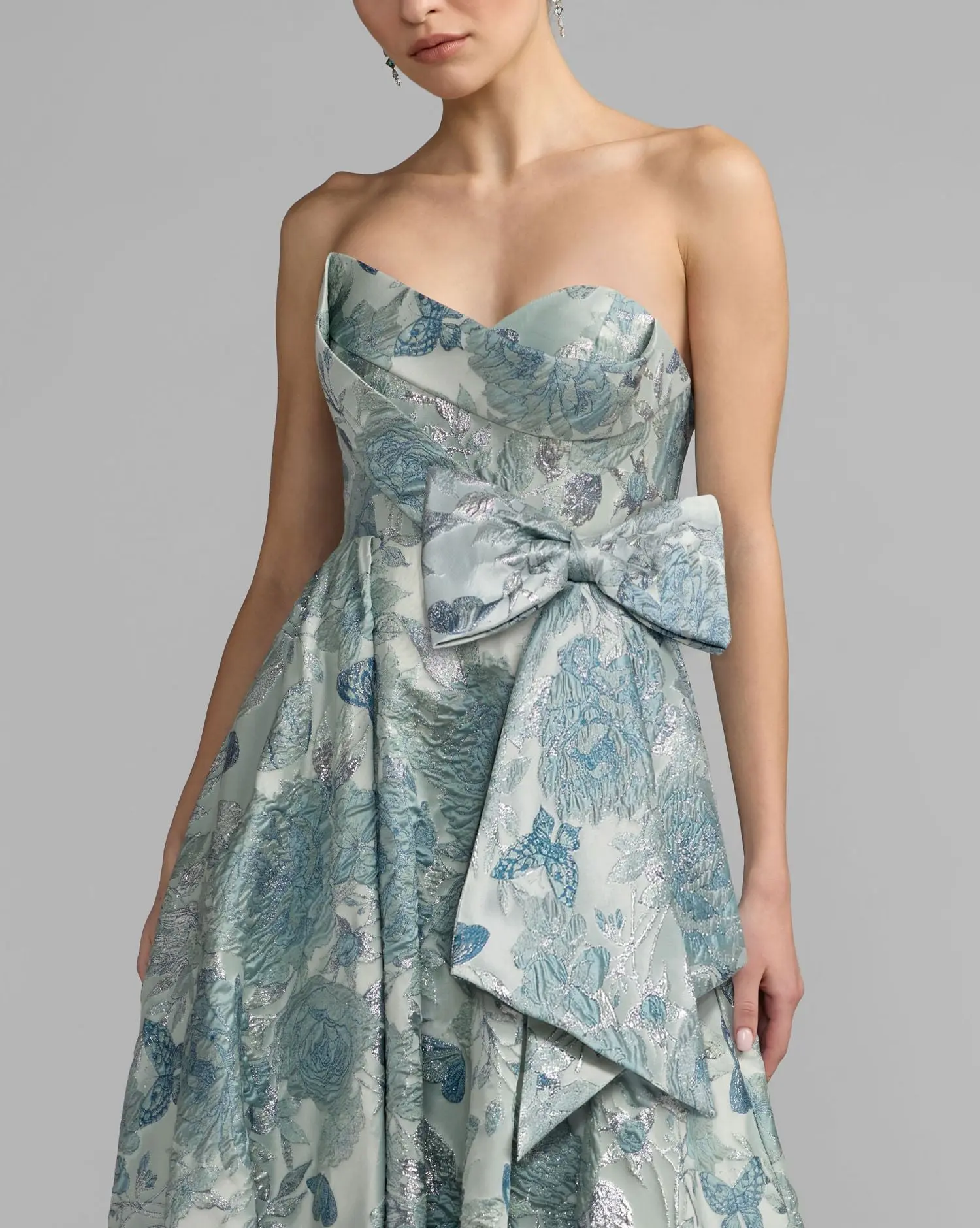 Blue Strapless Floral Brocade Ball Gown With Bow Detail - Special Events Unlimited